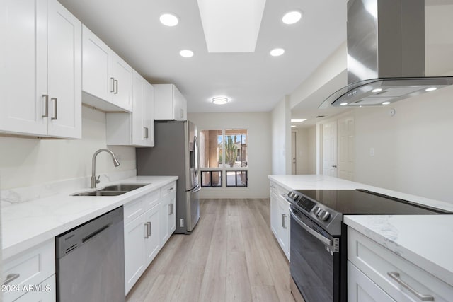 kitchen featuring sink, stainless steel appliances, exhaust hood, and white cabinets