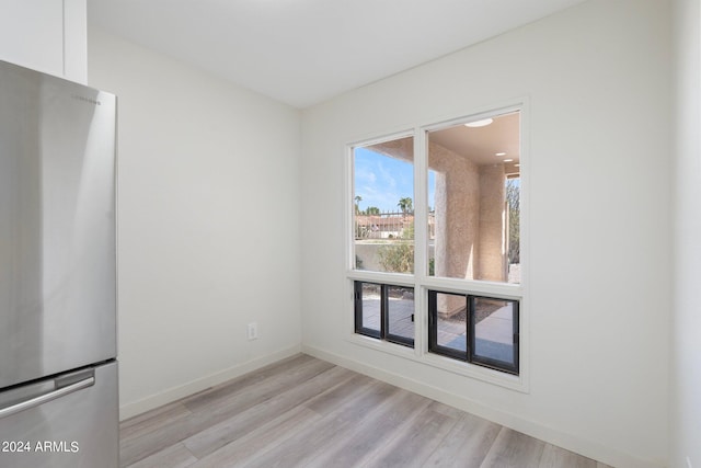 spare room featuring light hardwood / wood-style floors