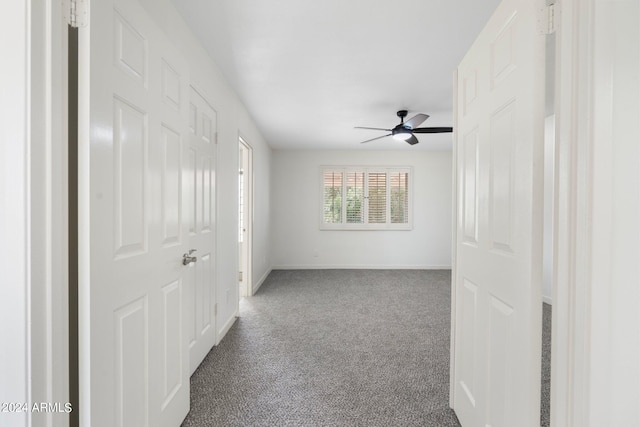 carpeted empty room with ceiling fan