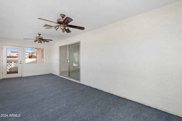 exterior space featuring ceiling fan