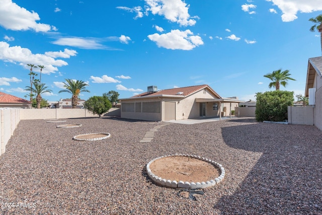 back of property with a patio