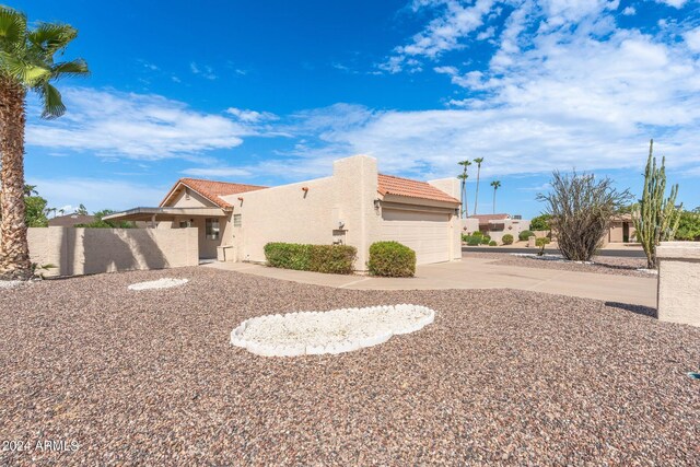 view of property exterior featuring a garage