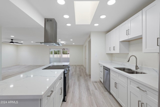 kitchen with ventilation hood, sink, white cabinets, and stainless steel appliances