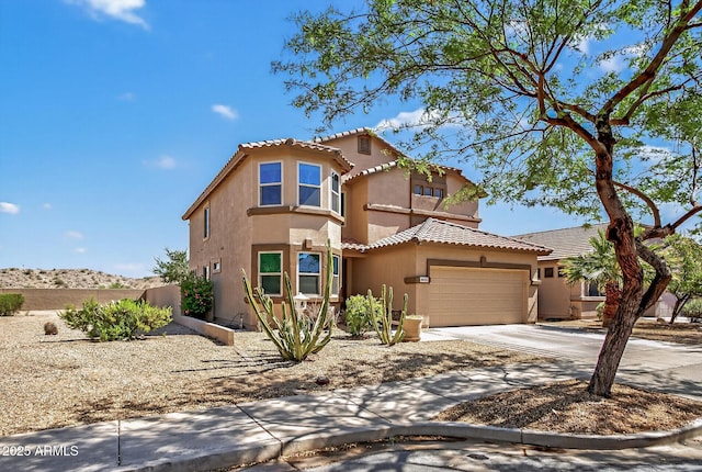 18132 W Cardinal Dr, Goodyear, AZ 85338 - view of front of house with stucco siding, an attached garage, concrete driveway, and a tiled roof