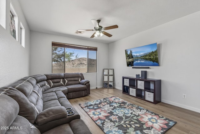 18132 W Cardinal Dr, Goodyear, AZ 85338 - living area with a ceiling fan and wood finished floors