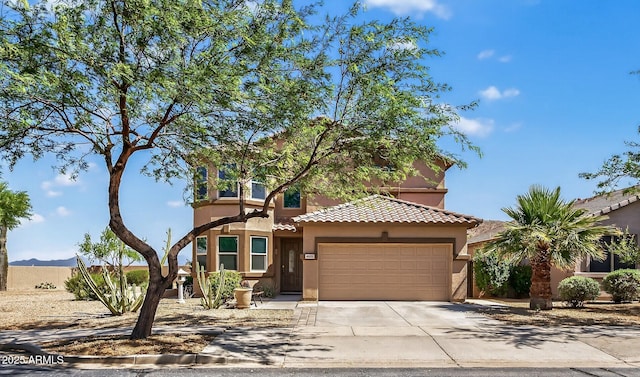 18132 W Cardinal Dr, Goodyear, AZ 85338 - view of front of home with a garage, stucco siding, a tile roof, and concrete driveway