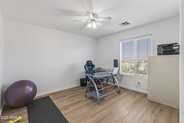 18132 W Cardinal Dr, Goodyear, AZ 85338 - office area featuring light wood-type flooring and a ceiling fan