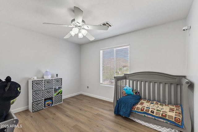 18132 W Cardinal Dr, Goodyear, AZ 85338 - bedroom featuring wood finished floors and a ceiling fan