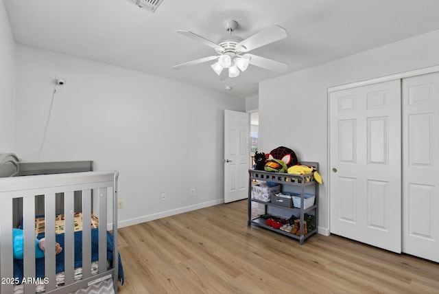 18132 W Cardinal Dr, Goodyear, AZ 85338 - bedroom featuring wood finished floors, a ceiling fan, and a closet