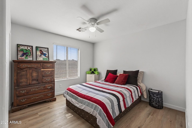 18132 W Cardinal Dr, Goodyear, AZ 85338 - bedroom with wood finished floors and a ceiling fan