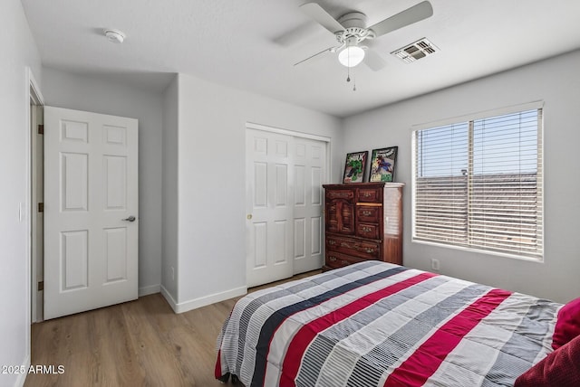 18132 W Cardinal Dr, Goodyear, AZ 85338 - bedroom with wood finished floors, a closet, and ceiling fan
