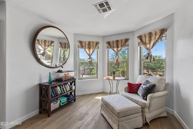 18132 W Cardinal Dr, Goodyear, AZ 85338 - sitting room featuring healthy amount of natural light and wood finished floors
