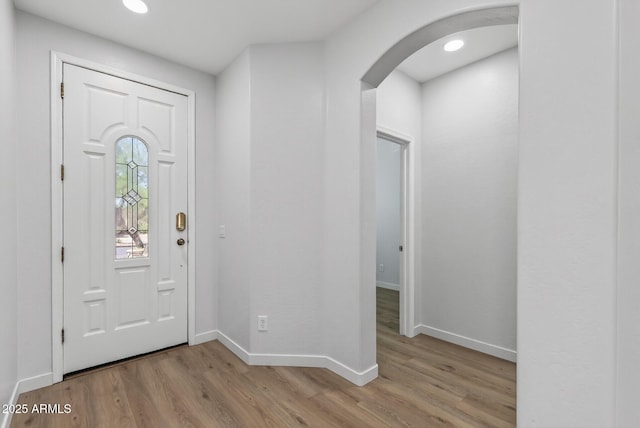 18132 W Cardinal Dr, Goodyear, AZ 85338 - entryway with arched walkways, light wood-style flooring, and recessed lighting