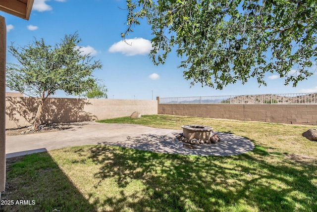 18132 W Cardinal Dr, Goodyear, AZ 85338 - fenced backyard featuring an outdoor fire pit and a patio
