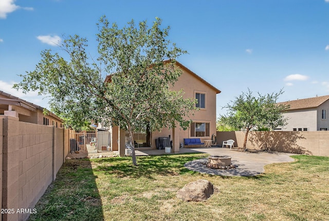 18132 W Cardinal Dr, Goodyear, AZ 85338 - back of property featuring a fire pit, a patio, and stucco siding