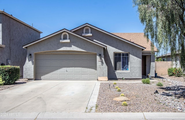 ranch-style home with a garage