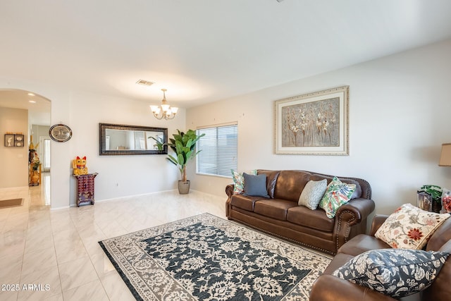 living room with a notable chandelier