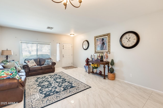 living room featuring a notable chandelier