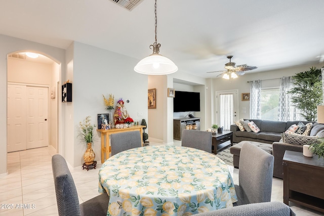 dining room with ceiling fan and light tile patterned flooring