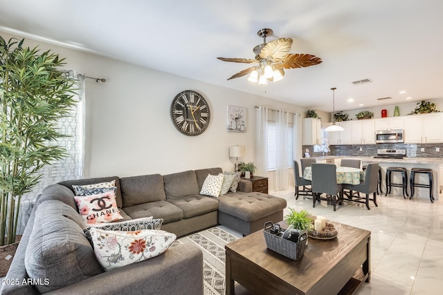 living room with ceiling fan