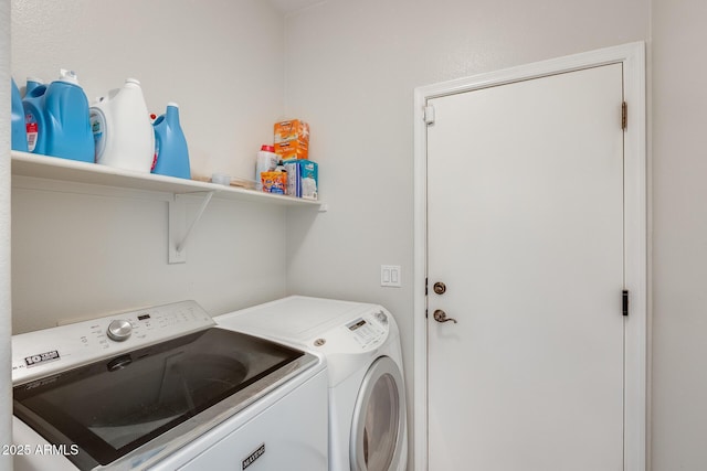 washroom with washer and dryer