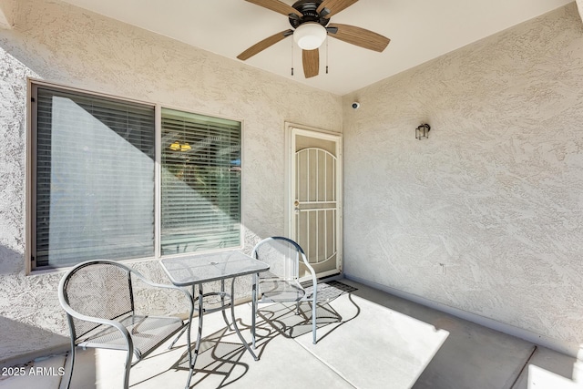 view of patio / terrace featuring ceiling fan