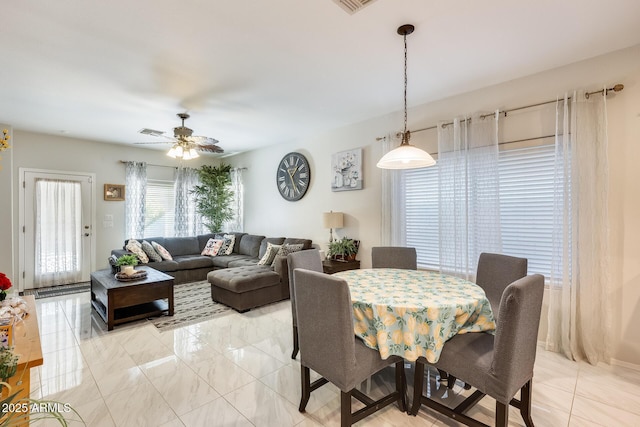 dining space featuring ceiling fan