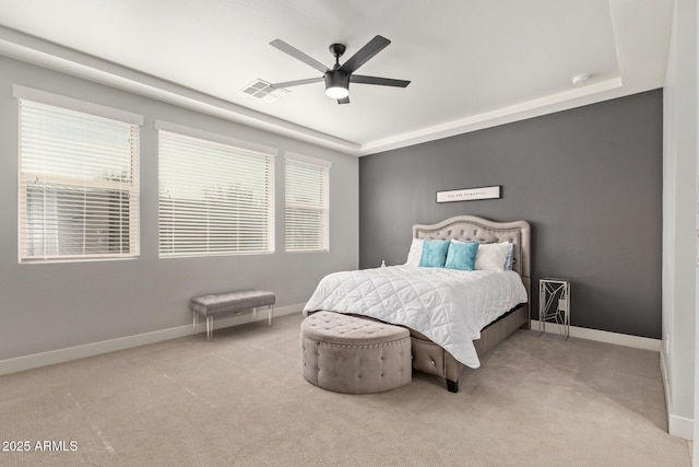 carpeted bedroom with visible vents, ceiling fan, and baseboards