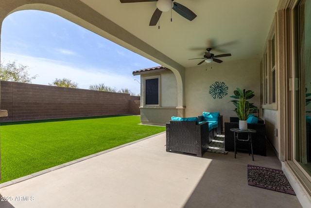 view of patio / terrace featuring ceiling fan, a fenced backyard, and an outdoor living space