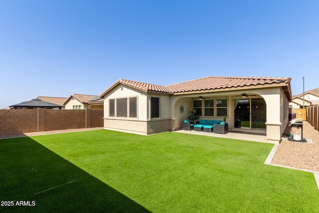 back of property featuring stucco siding, outdoor lounge area, a patio area, ceiling fan, and a fenced backyard