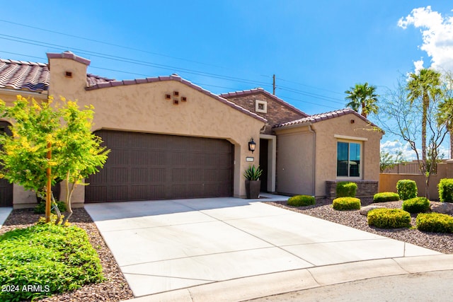 mediterranean / spanish-style home featuring a garage