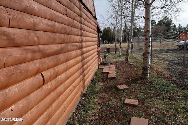 view of property exterior featuring fence