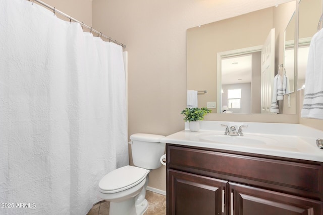 full bathroom with toilet and vanity