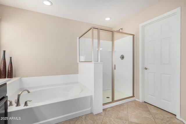 full bathroom with a stall shower, recessed lighting, a bath, and tile patterned floors