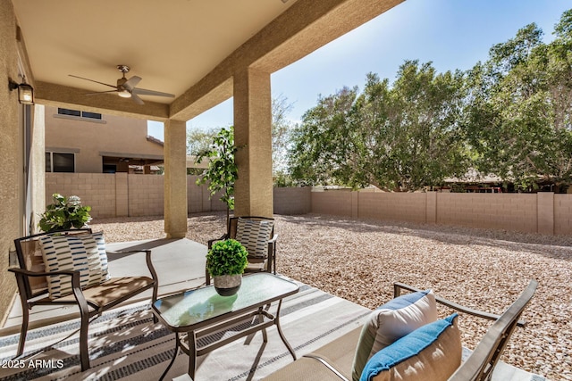 view of patio / terrace with ceiling fan and a fenced backyard