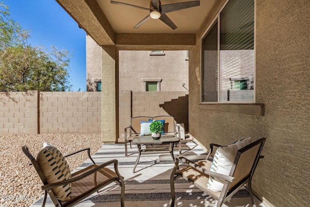 view of patio / terrace featuring fence and a ceiling fan