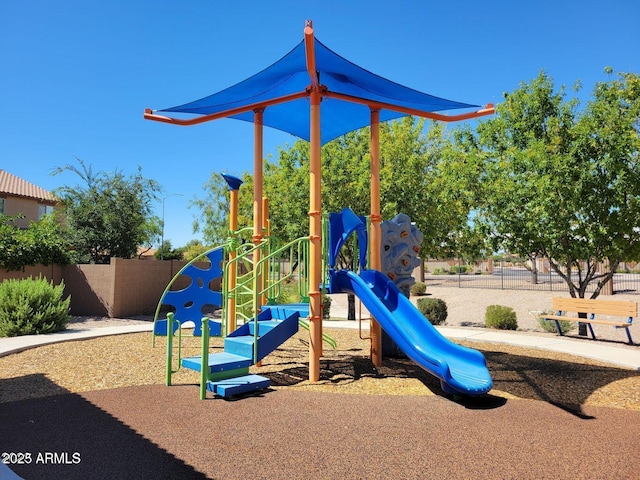 community jungle gym featuring fence