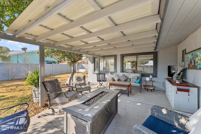 view of patio / terrace with an outdoor living space with a fire pit