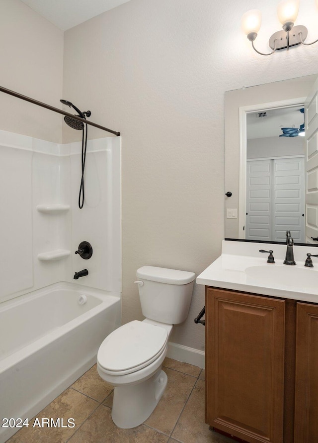 full bathroom featuring vanity, tile patterned flooring, toilet, and washtub / shower combination