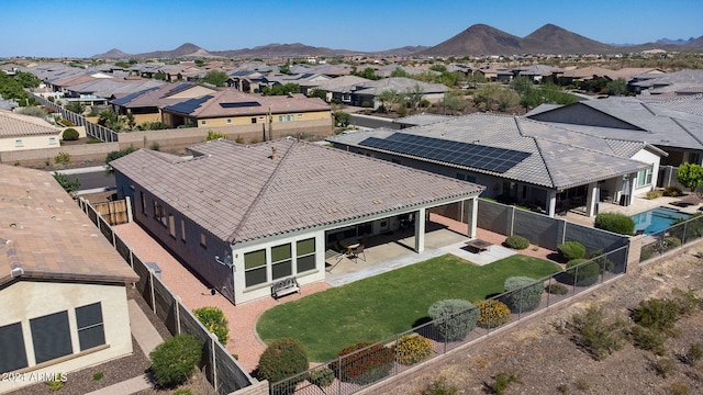 birds eye view of property featuring a mountain view