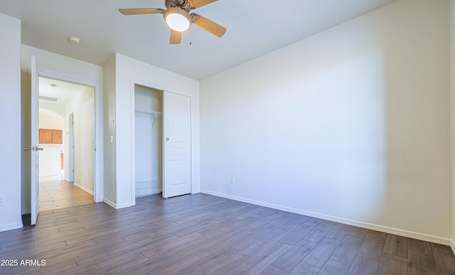 unfurnished bedroom featuring a closet and ceiling fan