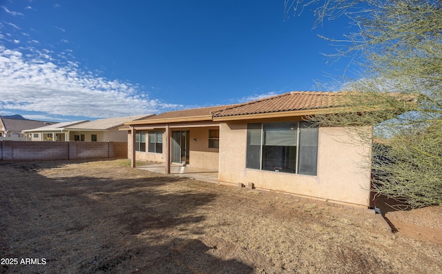 rear view of house with a patio