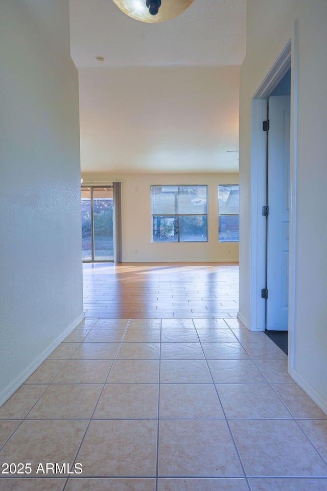 corridor featuring light tile patterned flooring