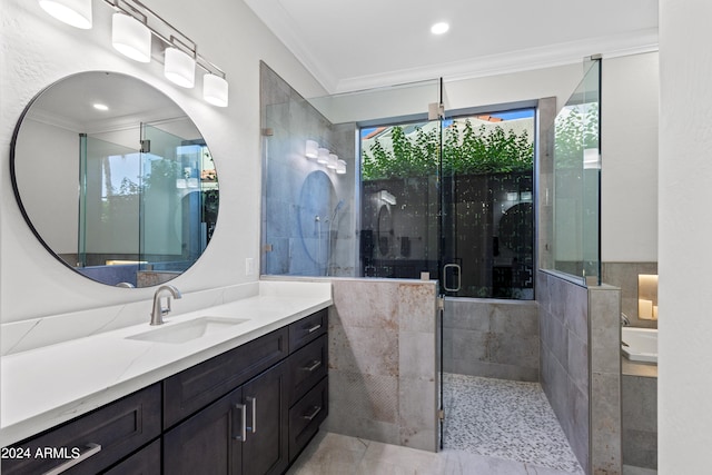 bathroom with a shower with door, crown molding, and vanity