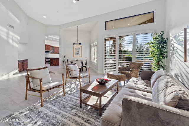 living room with a towering ceiling