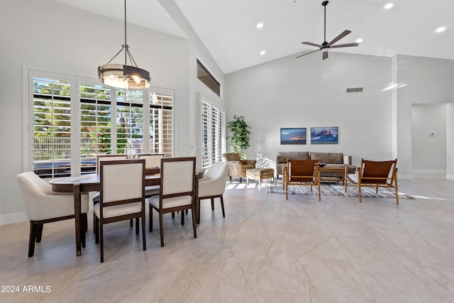 dining room featuring high vaulted ceiling and ceiling fan