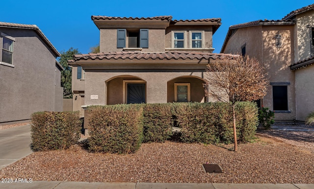 mediterranean / spanish house with stucco siding