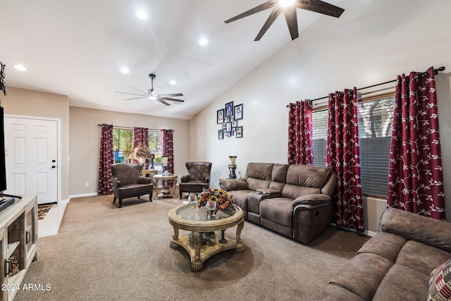 carpeted living room with high vaulted ceiling