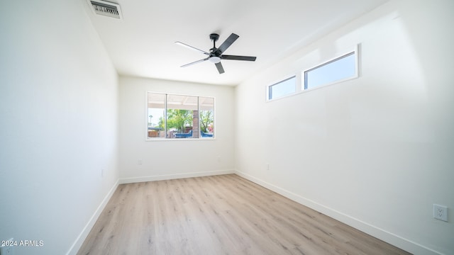 empty room featuring light hardwood / wood-style flooring and ceiling fan