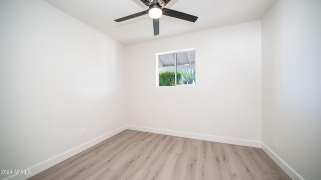 unfurnished room featuring ceiling fan and light hardwood / wood-style flooring